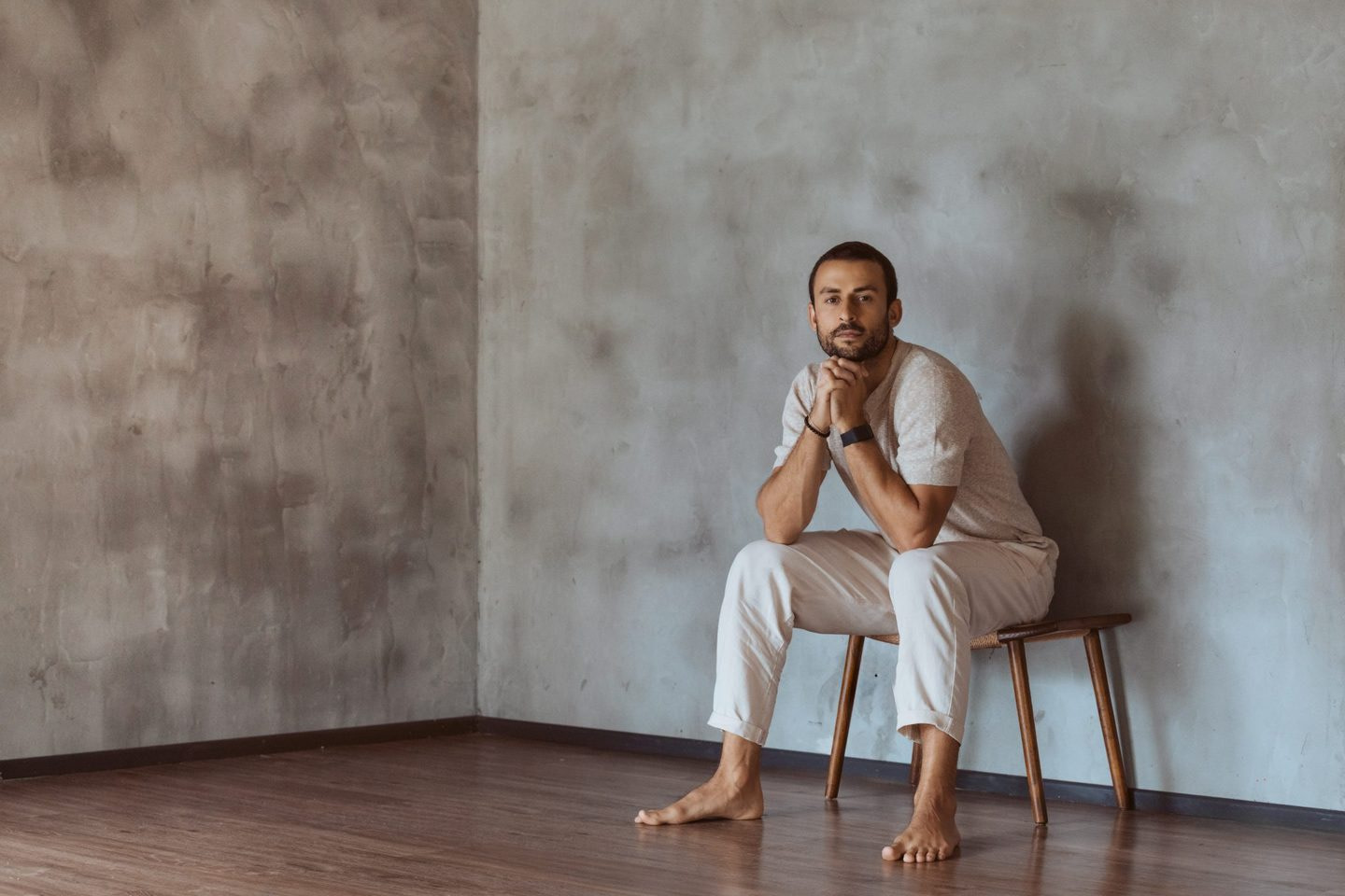 Pablo Guzman Embodied Wellbeing Practitioner Brisbane Pablo Guzman seated in a studio, embodied wellbeing practitioner and Zenthai Shiatsu therapist based in Brisbane